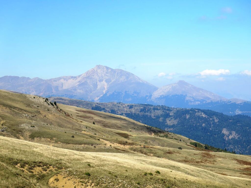 Saradena ridge: cropped grass with bare rocky mountains beyond